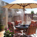 Create Your Own Oasis with a Patio Umbrella or Cabana and a Misting System or Fans from Cool-Off.com