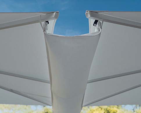 Close-up of a gray fabric canopy with a blue sky background