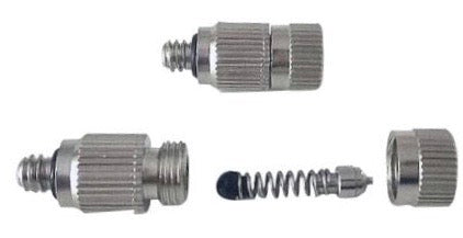 Metal components including a spring and two threaded connectors on a white background