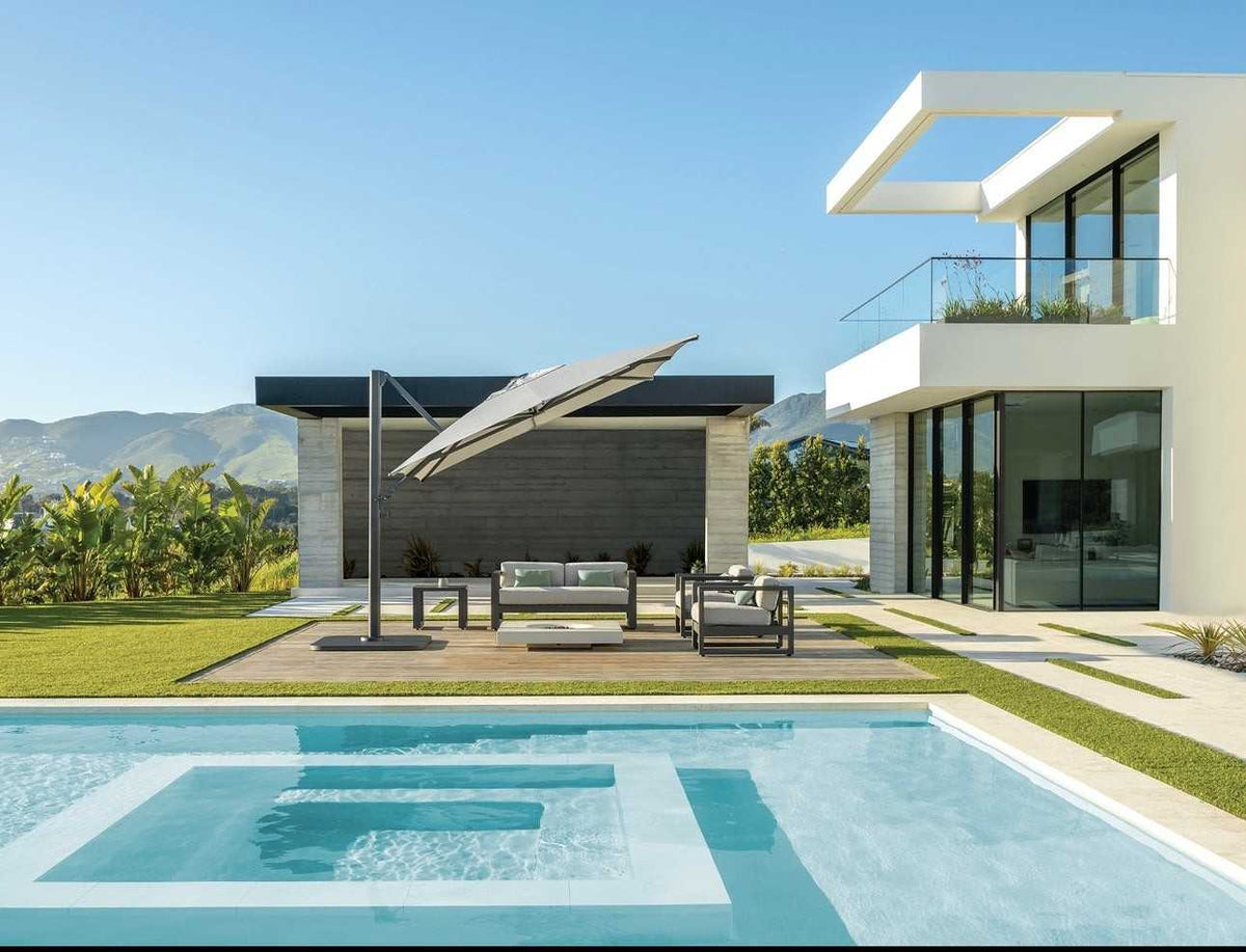 Modern house with pool and outdoor furniture on a sunny day