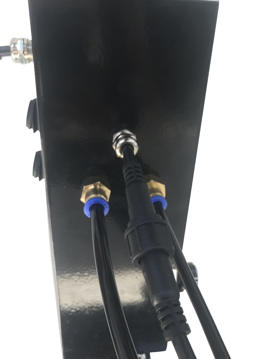 Black metal panel with cables and connectors on a white background