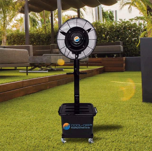 Portable outdoor fan on a grassy area with a patio in the background