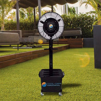 Portable outdoor fan on a grassy area with a patio in the background