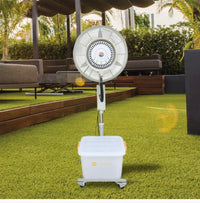 Portable outdoor fan on a grassy area with a gazebo and furniture in the background