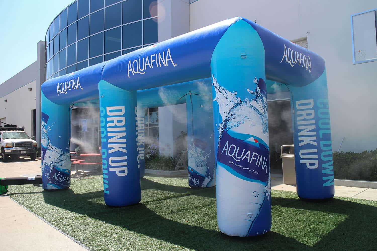 Aquafina inflatable archway with branding in front of a building