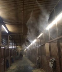 Horse stable with misting system in action