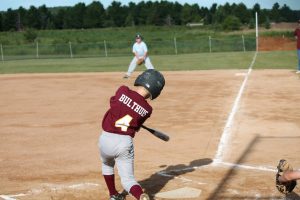 little league baseball player up to bat