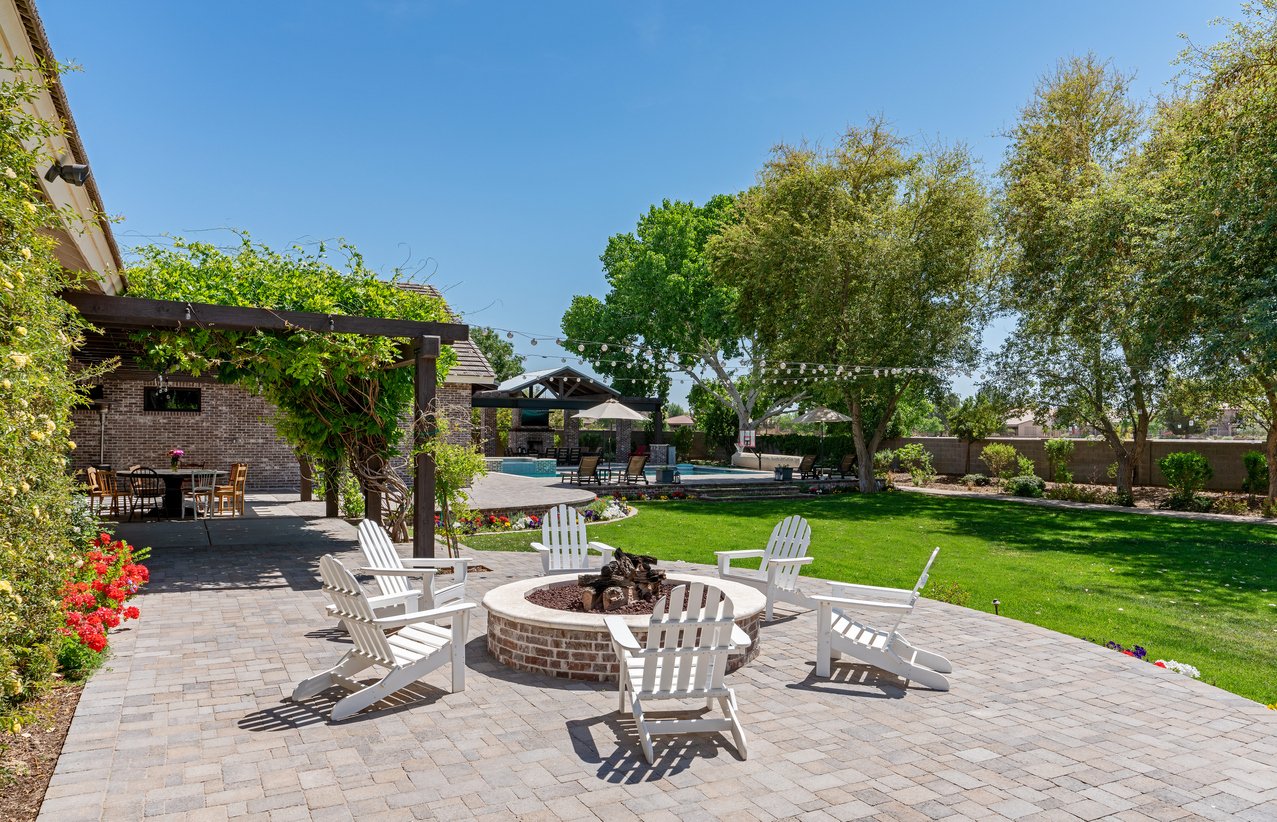 patio with chairs and fireplace